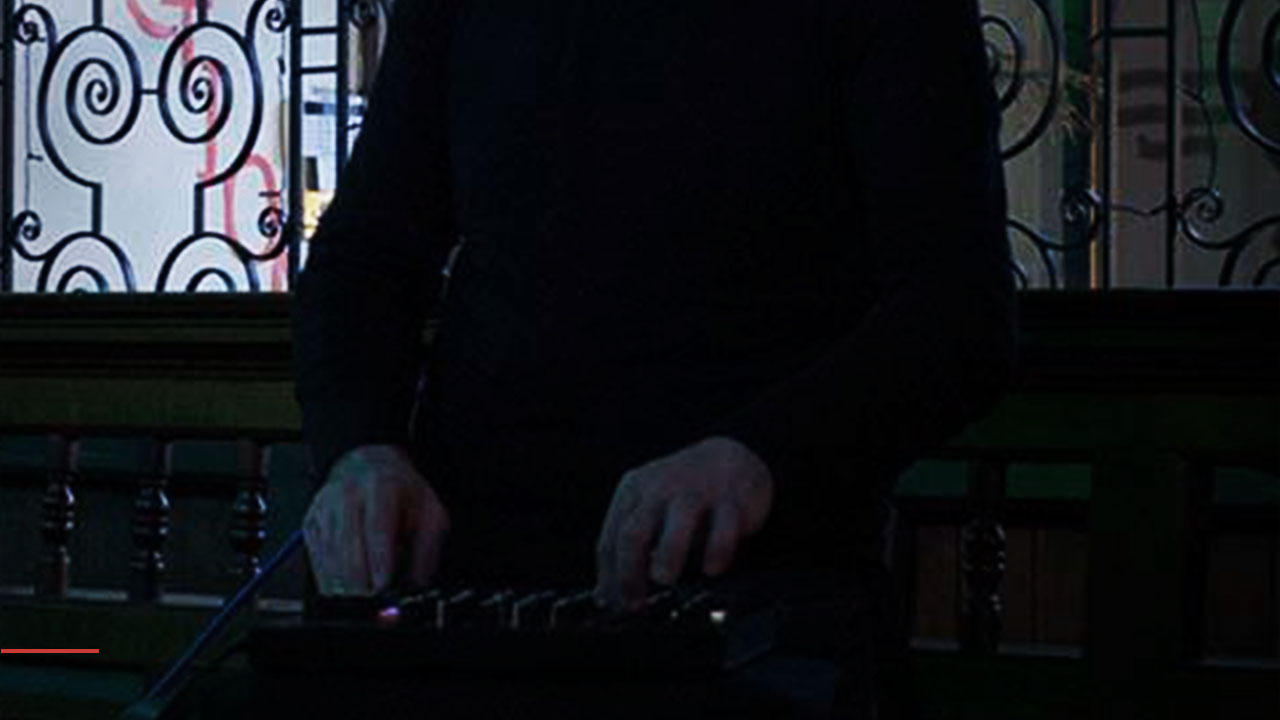 A performer's hands on a music controller