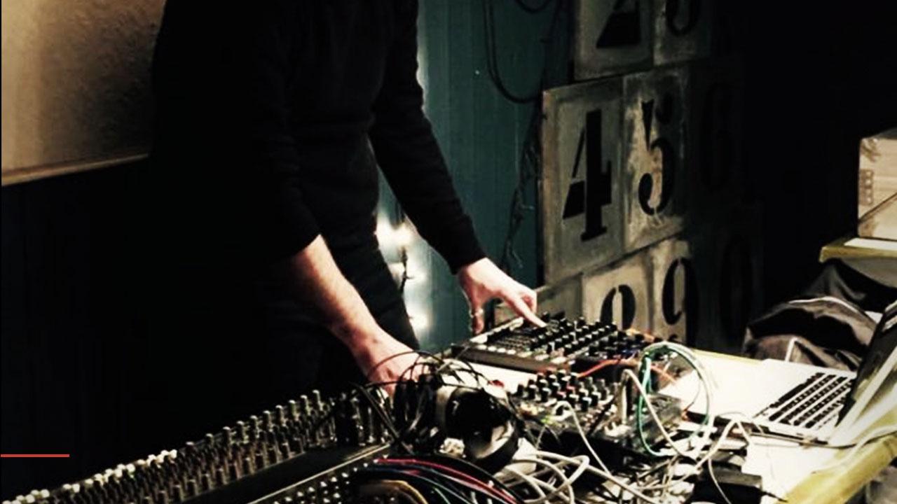 Performer's hands on mixing boards
